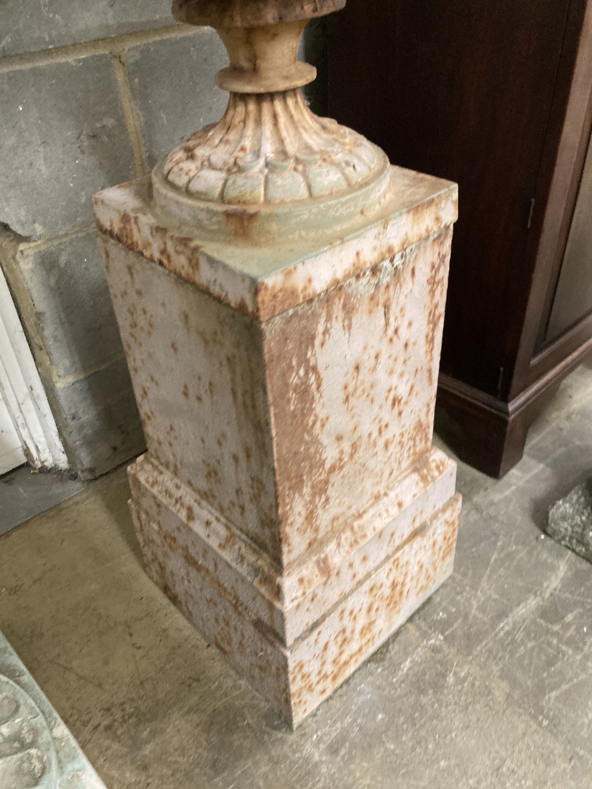 A Victorian style cast iron campana garden urn on stand, diameter 52cm, height 97cm